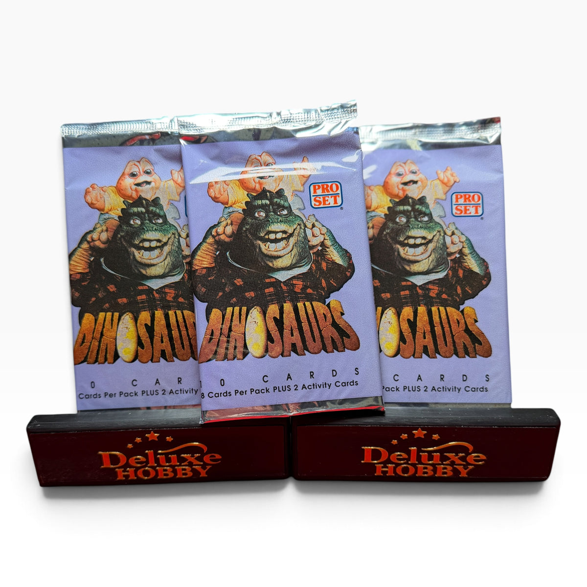 Three sealed 1992 Pro Set Dinosaurs trading card packs